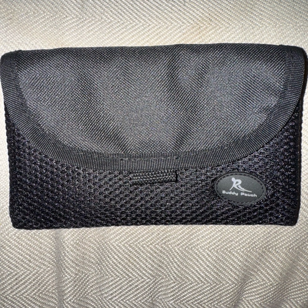NWOT- magnetic pouch with velcro, 2 pockets inside. Can hook onto something thin